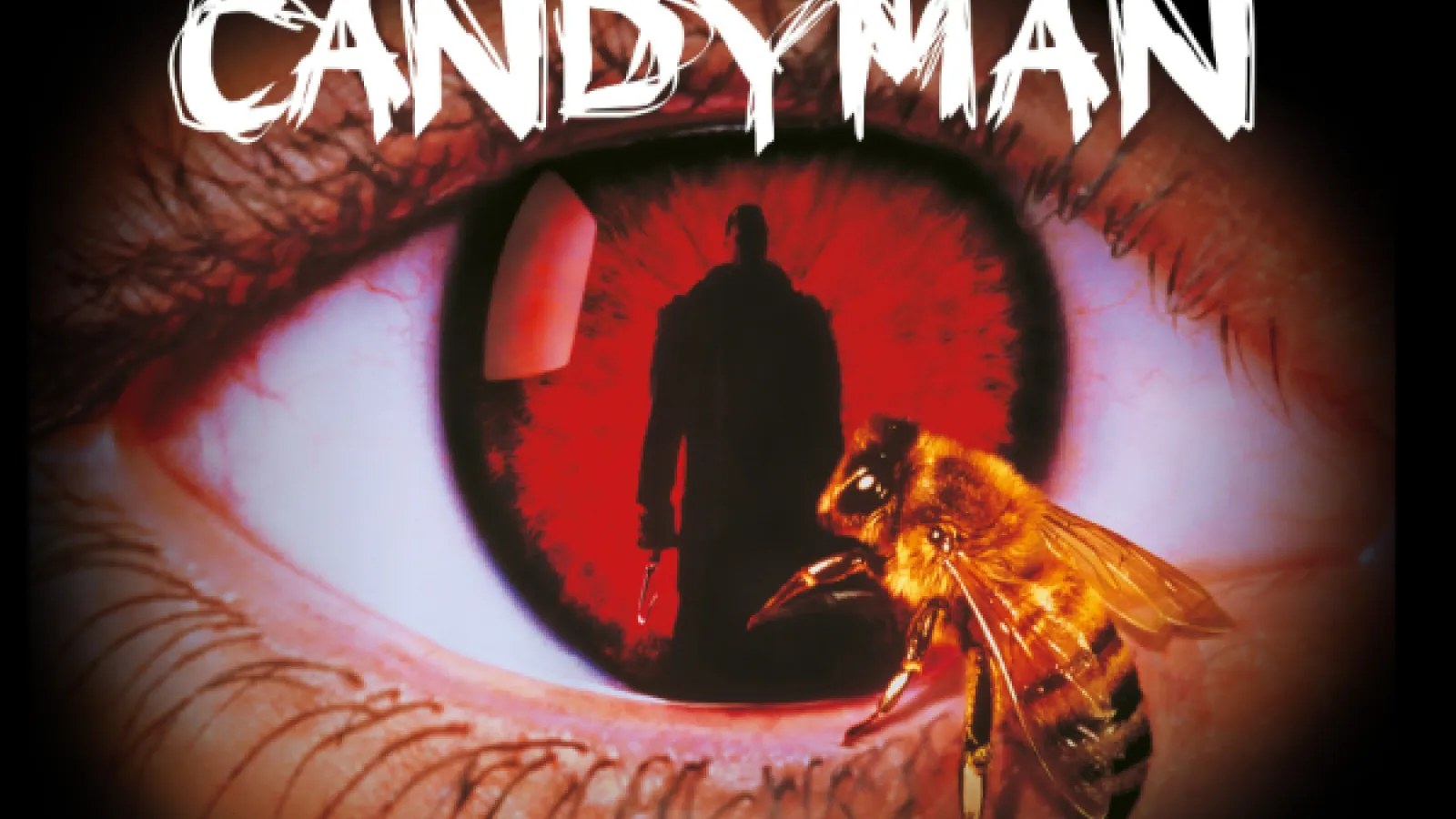 The word "Candyman" with an eyeball with a red iris, the sillhouette of a man reflected in it, and a bee touching the eyeball. 