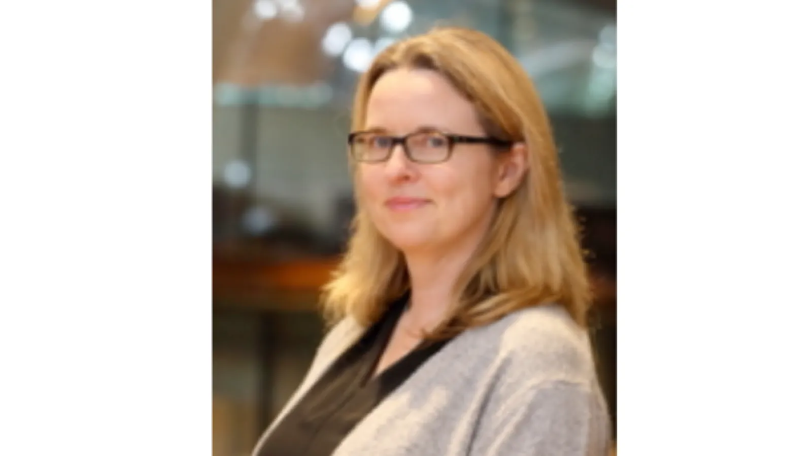 Headshot of Alison Fish, she has shoulder length blonde hair and brown glasses. 