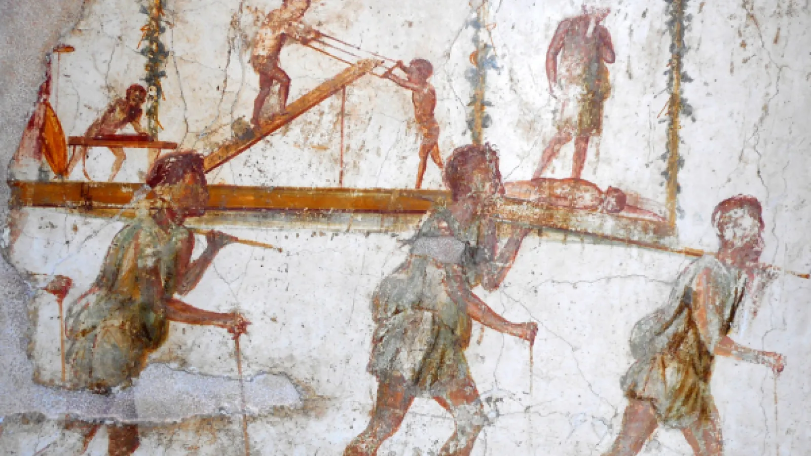 Cave painting of 3 men carrying a log with more workers in the background.
