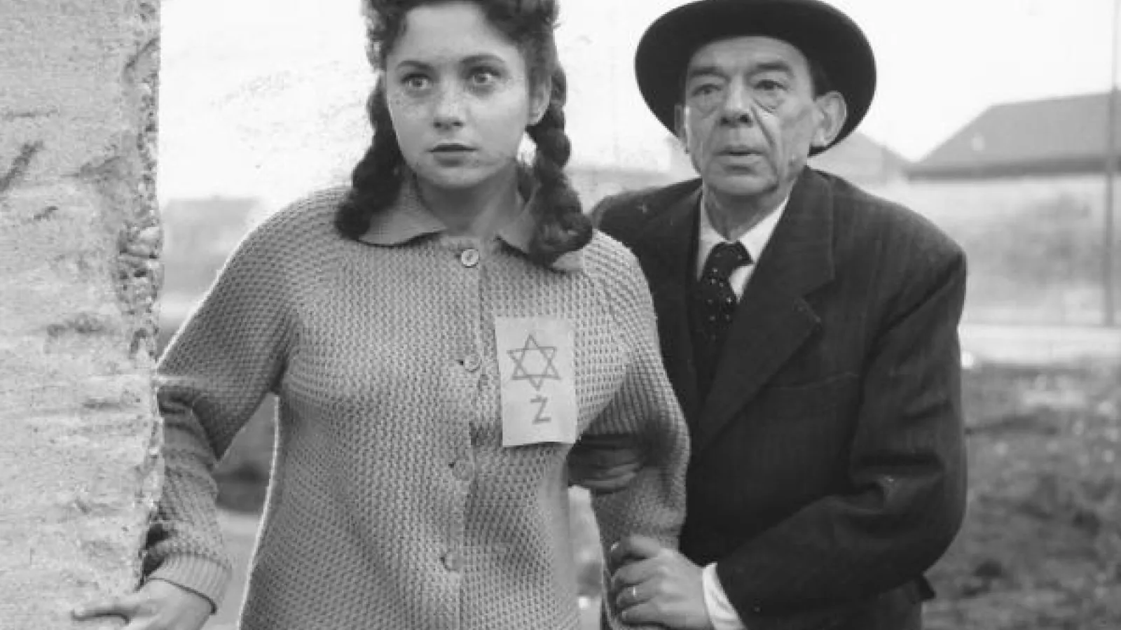Black and white screenshot of a man and a woman from The Ninth Circle