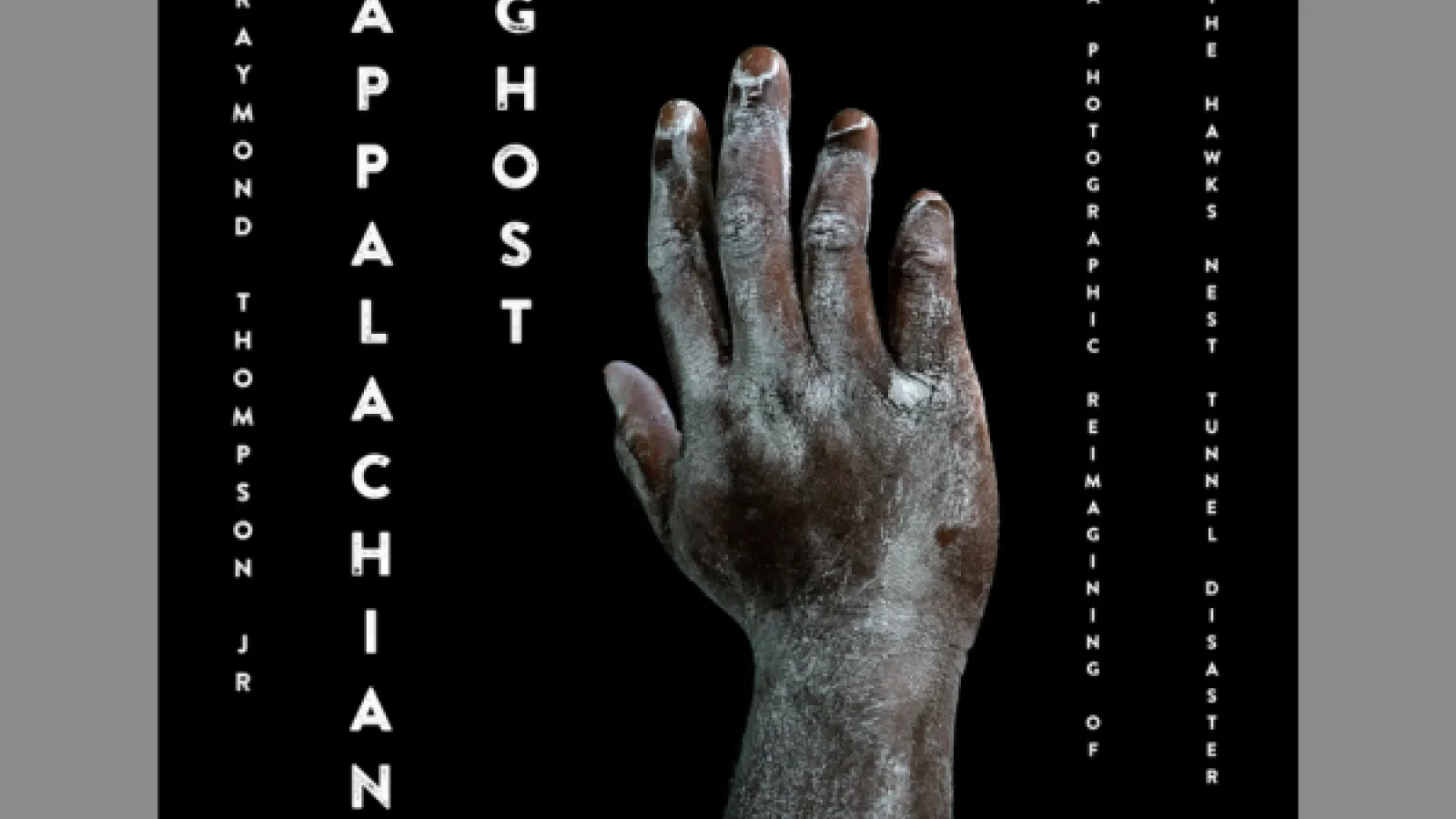 An African-American hand with white dust all over it