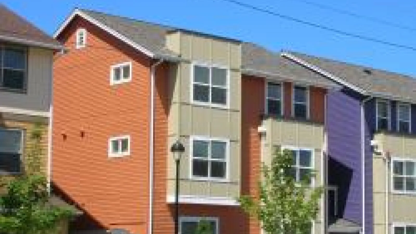 an apartment building with rows of windows