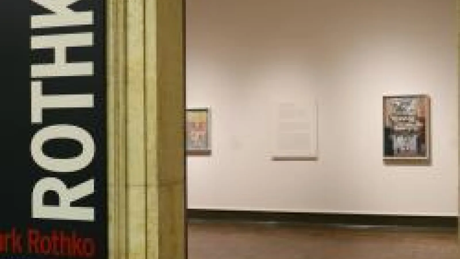 The entryway to a museum gallery and the text on the doorway says rothko