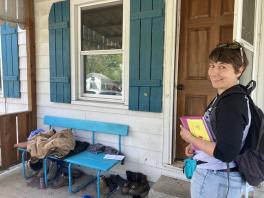 Anisa Kline in front of a door