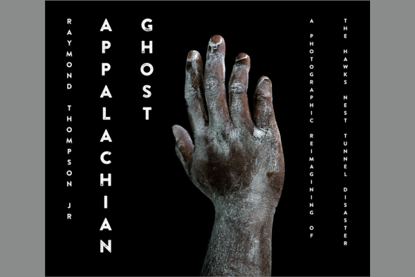 An African-American hand with white dust all over it