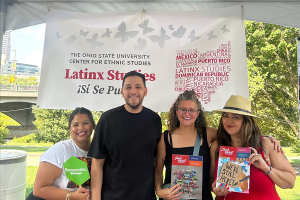 Four people standing in front of a banner that reads OSU Latinx Studies Program