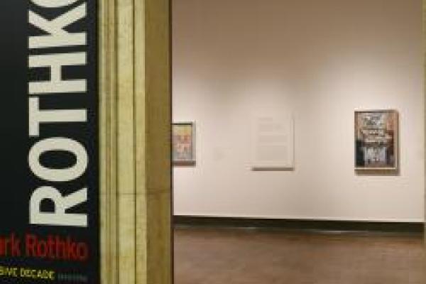 The entryway to a museum gallery and the text on the doorway says rothko