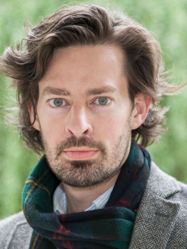 headshot portrait of man with scarf